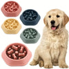 A set of pink and blue anti-choking slow feeder dog bowls with puzzle designs for feeding.
