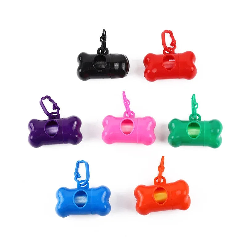 A collection of brightly colored bone-shaped dog waste bag dispensers in black, red, purple, pink, green, and blue.