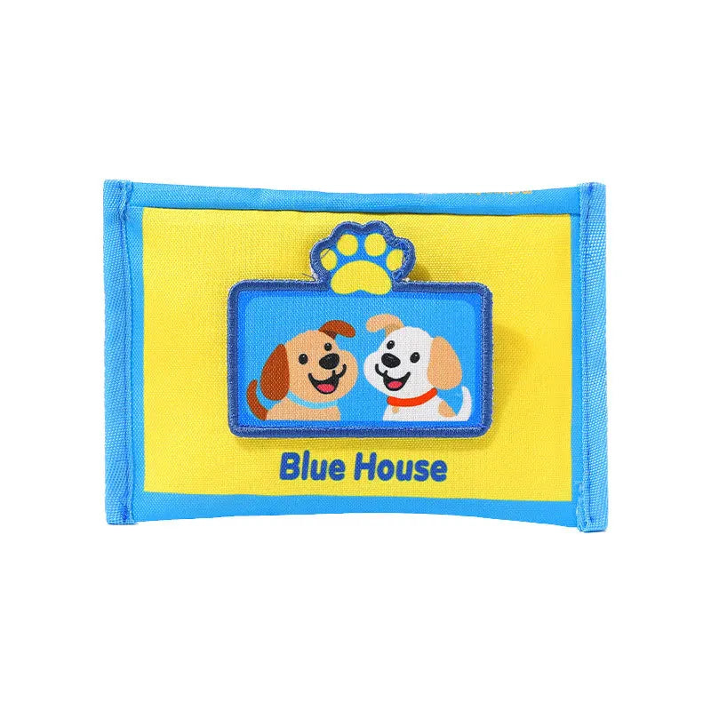 A blue house shaped fabric pouch featuring a yellow background and a blue puzzle with a dog paw print.