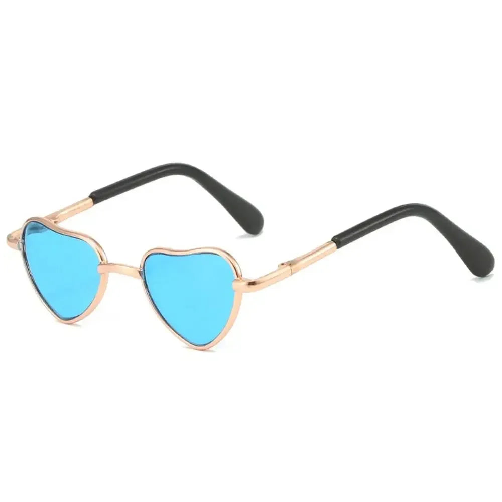 Funny heart-shaped pet sunglasses with blue lenses and gold-toned frames