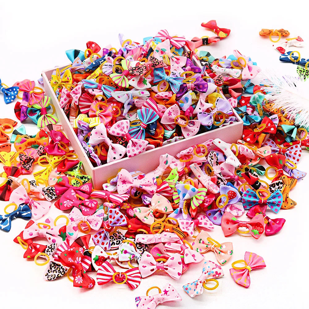 A pile of 30-piece handmade dog bows in various bright colors and patterns for hair accessories.
