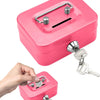 A pink portable metal cash box with a handle, lock, and keys is shown being held by a hand.