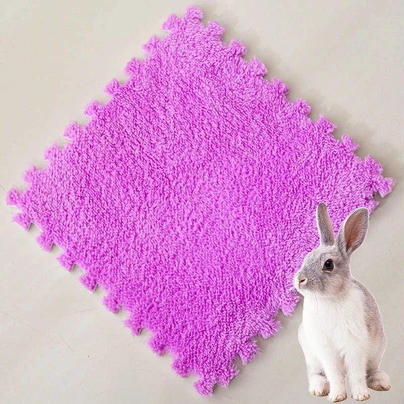 A bright purple, textured fleece pet warming mat with a small white rabbit resting on it.