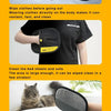 A hand wearing a black electrostatic glove is cleaning pet hair from a cat.