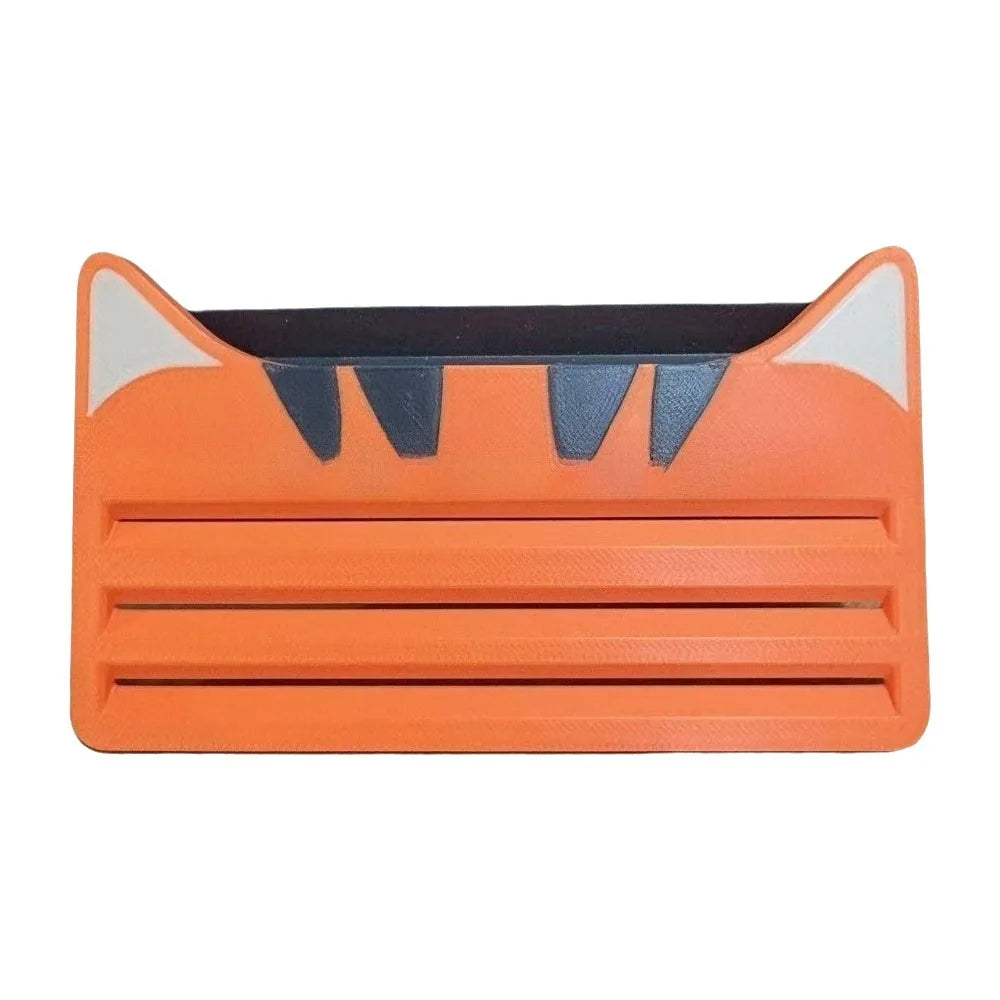 Orange and white reusable cat food pouch scraper with black teeth