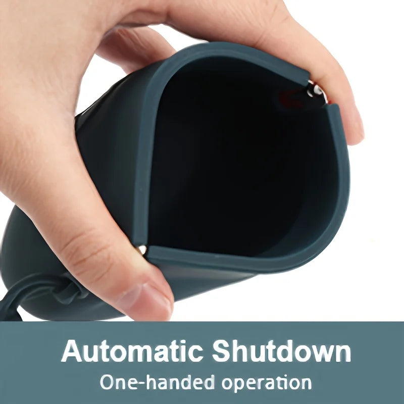 A hand is holding a dark gray silicone pouch with an automatic shutdown feature.