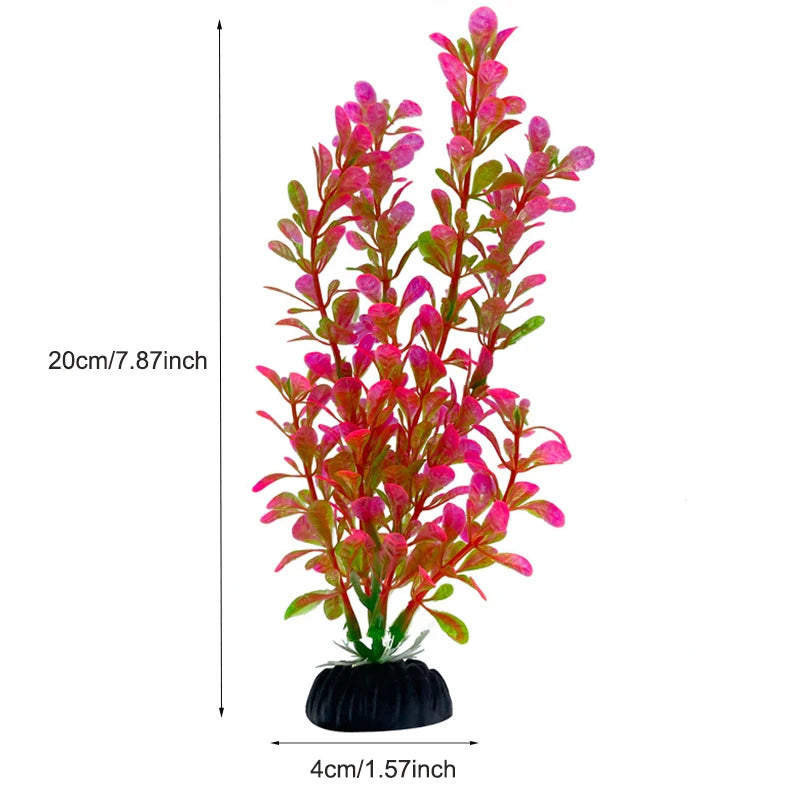 Plante aquatique artificielle vibrante avec des feuillages rose vif et rouge dans un pot noir.