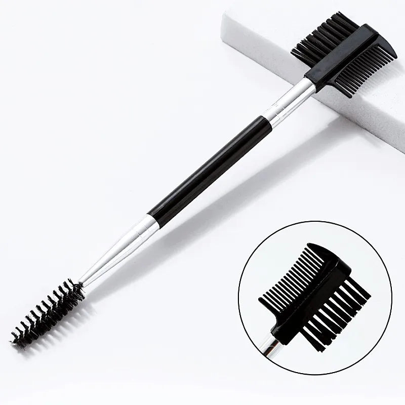 A black pet face comb with a silver handle is shown against a white background.