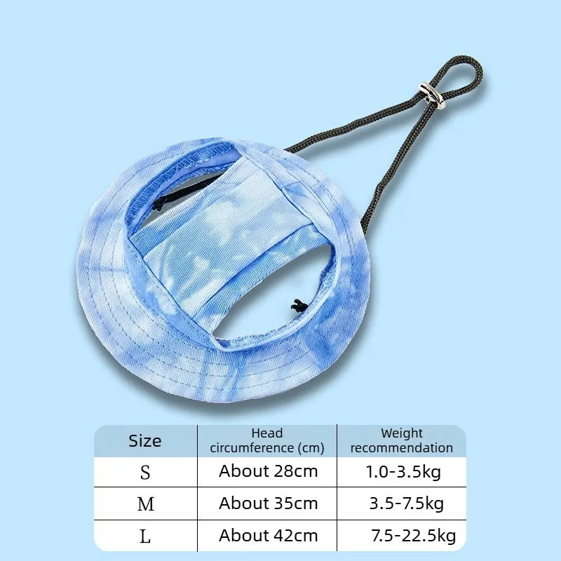Light blue pet bucket hat with a white cartoon print shown flat against a light blue background.