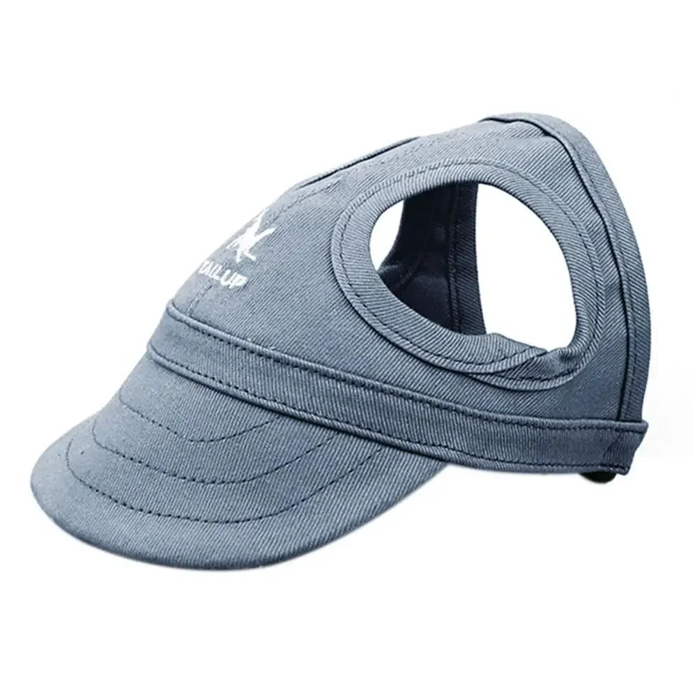 A grey adjustable pet baseball cap with a cutout for the head, shown from the side.