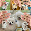A collection of transparent pet hair memorial keychains featuring various dog breeds and pets.