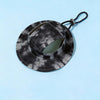 A black and gray tie-dye bucket hat with a strap is shown against a light blue background.