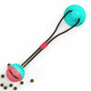 A bright teal suction cup chew ball for dog dental care and play with a brown cord.