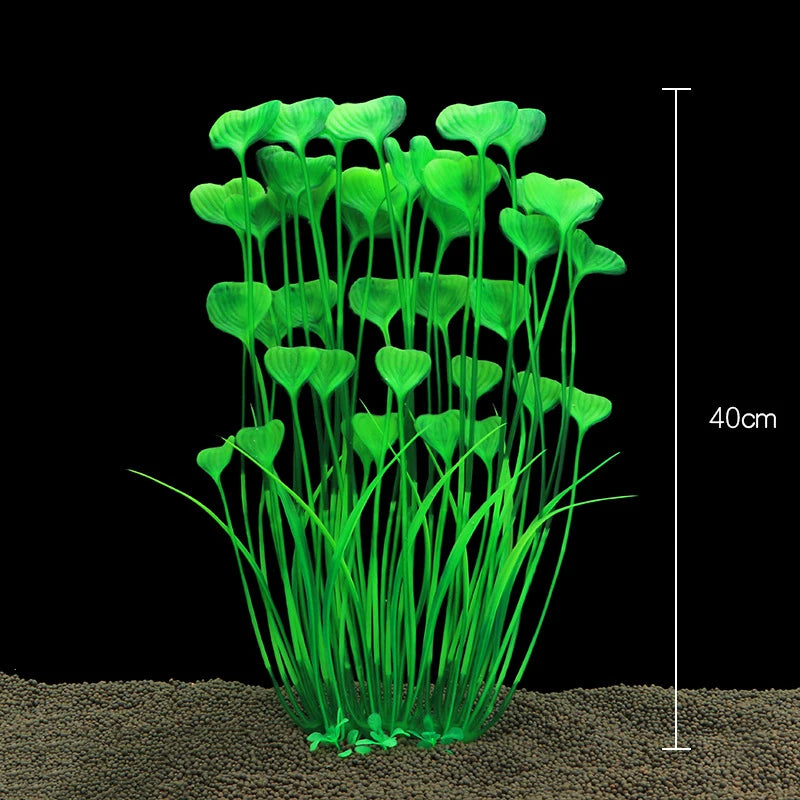 Un touffe de plantes aquatiques artificielles vert vif poussant dans du sable.