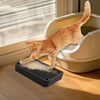 An orange tabby cat is stepping onto a litter box ramp step with a filter tray inside a light-colored plastic container.