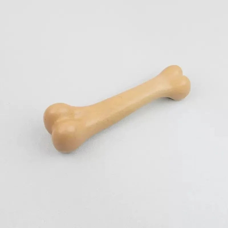 A light tan natural wood chew toy for dogs, shaped like a bone.