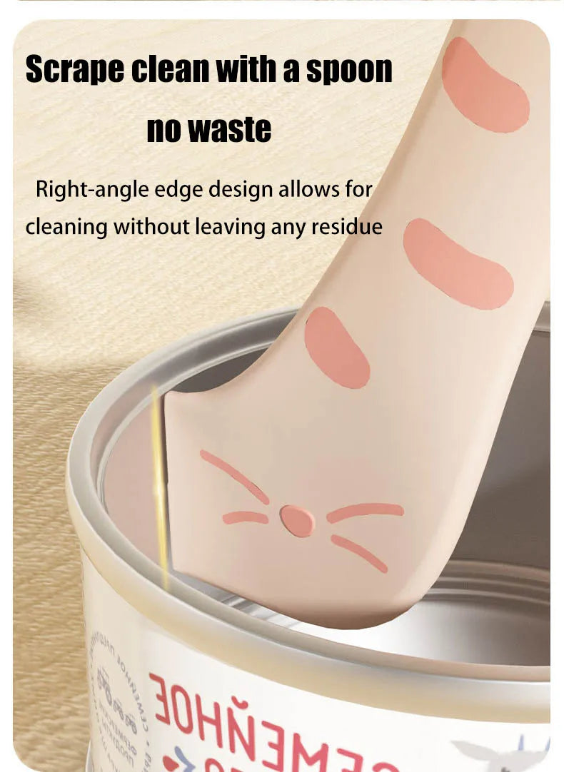 A close-up of a silicone pet can opener and feeding spoon designed for cleaning without waste.