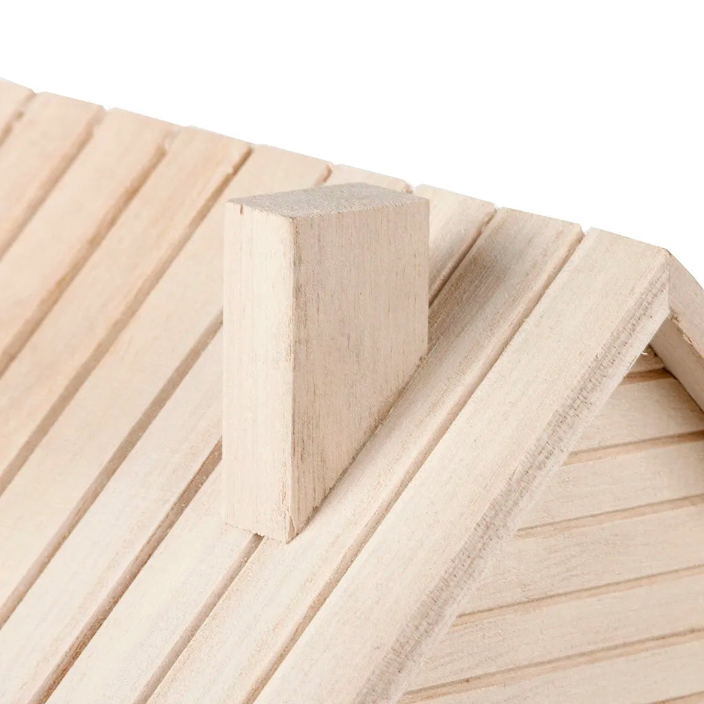 A light wooden birdhouse with a square perch is shown against a background of wooden slats.