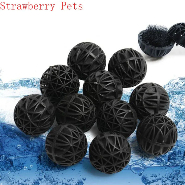 Black bio balls used for aquarium water filtration resting on a blue surface.
