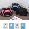 Three portable foldable pet carriers for cats and dogs in black, pink, and blue against a light background.