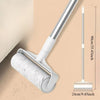 A silver retractable lint roller mop with a white handle and roll is shown against a beige background.