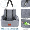 A gray quilted dog car seat with a black harness and hook, designed for safe road travel.