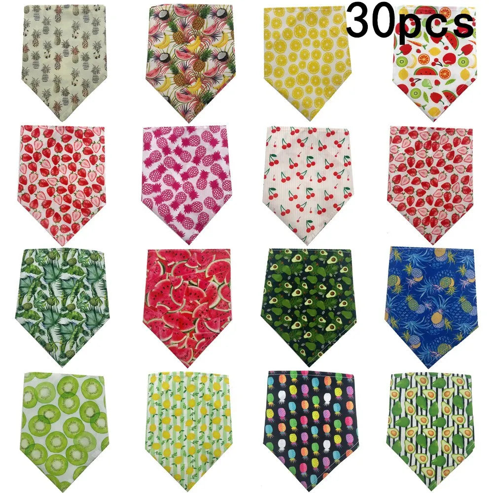 A collection of ten colorful summer fruit print dog bandanas made of soft cotton fabric.