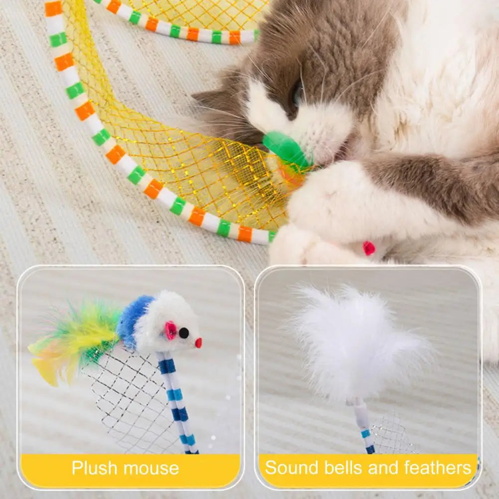 A fluffy cat is playing with a yellow mesh tunnel featuring plush mouse toys and sound bells and feathers.