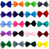 A collection of colorful adjustable pet bow ties for dogs and cats in various shades of blue, orange, green, purple, pink, bl