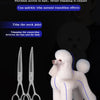 A pair of professional pet magic scissors used for detail trimming on a white poodle.