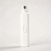 A white electric pet nail grinder bottle with a black cap, shown against a light background.