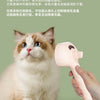 A person is using a pink dual function grooming comb and massage brush on a fluffy ginger and white cat.