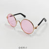 Vintage round pink sunglasses with gold-toned metal frames