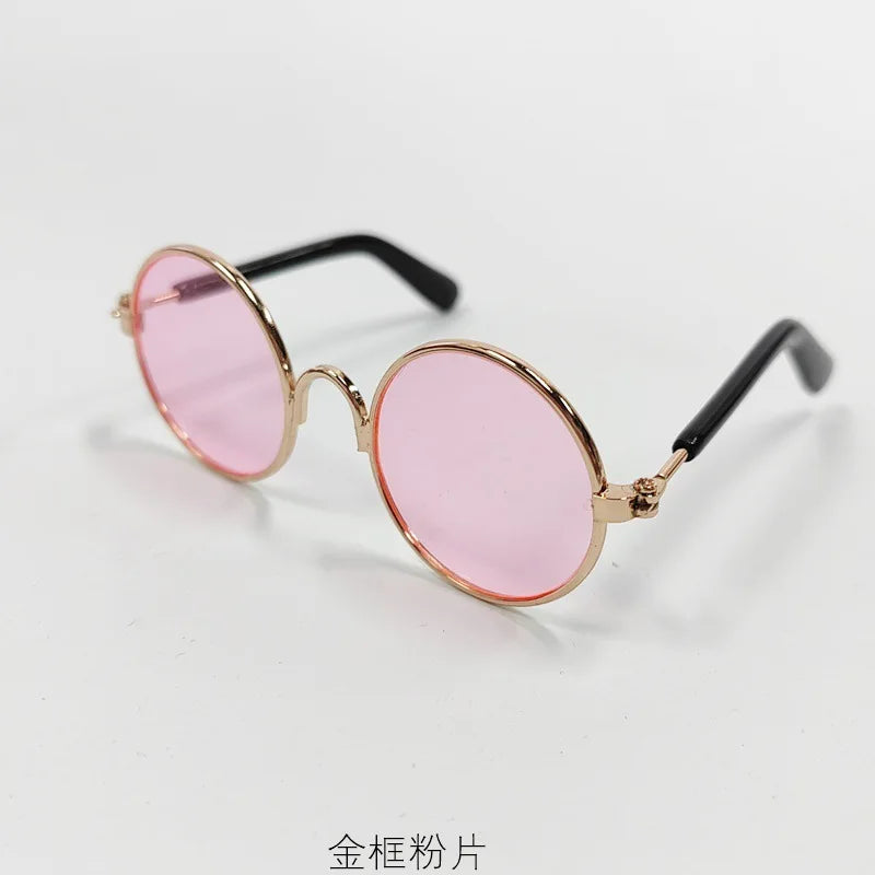 Vintage round pink sunglasses with gold-toned metal frames