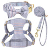 A plaid dog collar, harness, and leash set featuring a bowtie in blue and gray stripes.