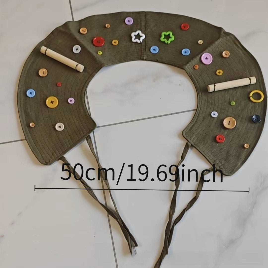 A handmade felt headband decorated with various colored buttons and star shapes for a parrot anti-plucking and biting coat.