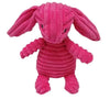 A pink corduroy squeaky dog toy shaped like an elephant with long ears.