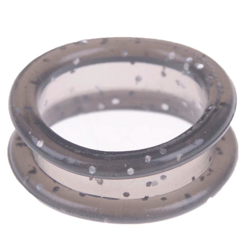 A clear silicone ring with small particles, likely a silica gel hair scissors set.