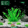 A clump of bright green artificial aquarium plants displayed on a light gravel substrate.