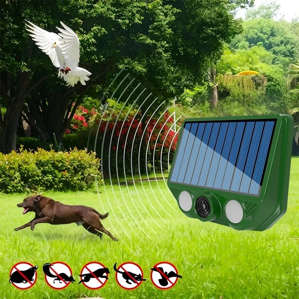A green solar pest repellent device is shown in a garden setting with a white bird and a dog nearby.