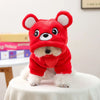 A red flannel hoodie with white trim and bear ears is shown on a white table.