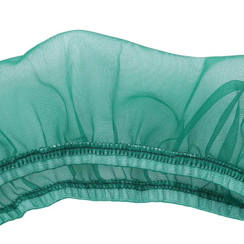 Close-up of a sheer teal nylon mesh seed guard for a bird cage