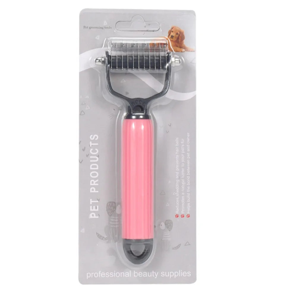 A pink pet detangling comb with a stainless steel comb attachment is shown in packaging.