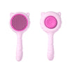 A pink pet deshedding brush for cats and dogs with a self-cleaning design, shown from the side.