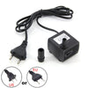 Pompe submersible noire avec cordon, adaptateur d'alimentation et connecteurs pour aquarium.