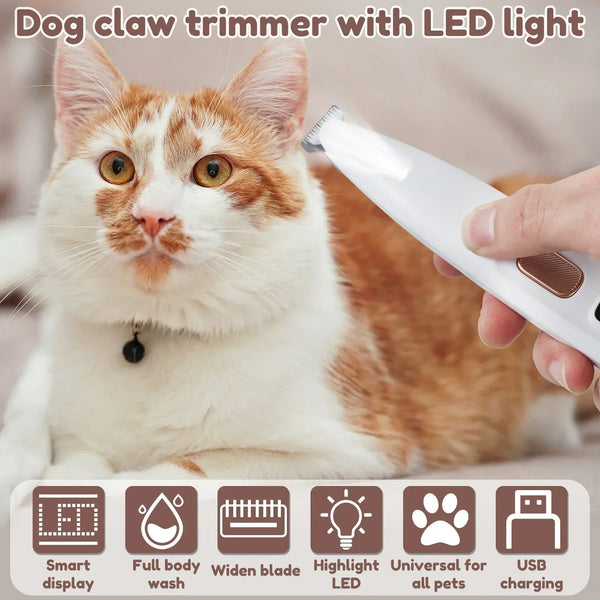 A cat is being groomed with a handheld pet hair trimmer featuring an LED light and various attachments.