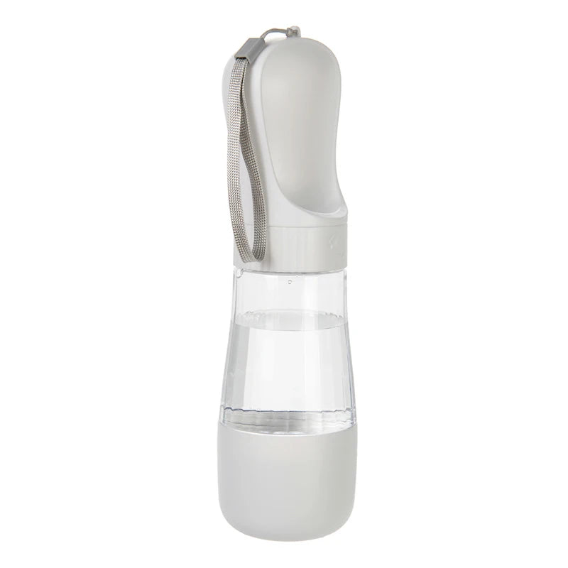 A white 2-in-1 portable pet water and food dispenser with a clear reservoir and a silicone strap.