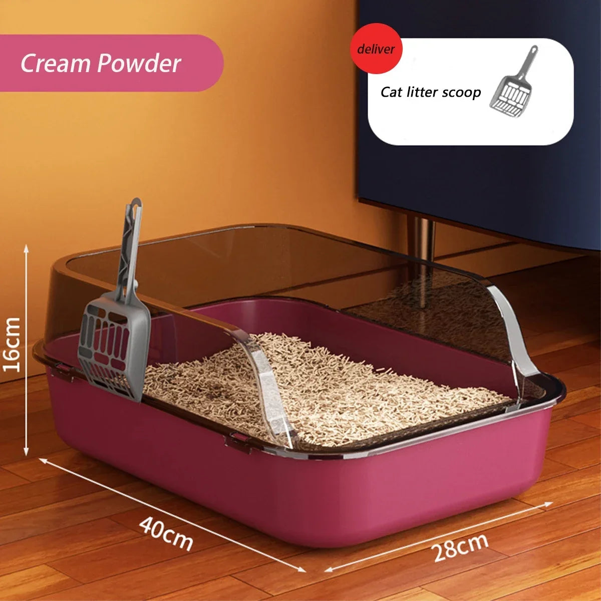 A pink semi-enclosed cat litter box with a splash guard and scoop is shown on a wooden floor.