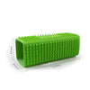A bright green pet hair removal brush with silicone hollow rubber bristles shown from the side.