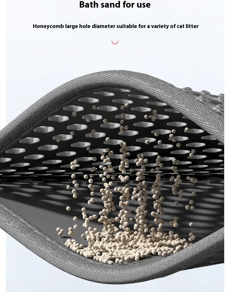 A close-up view of a honeycomb large hole diameter bath sand for use mat showing cat litter falling through the holes.